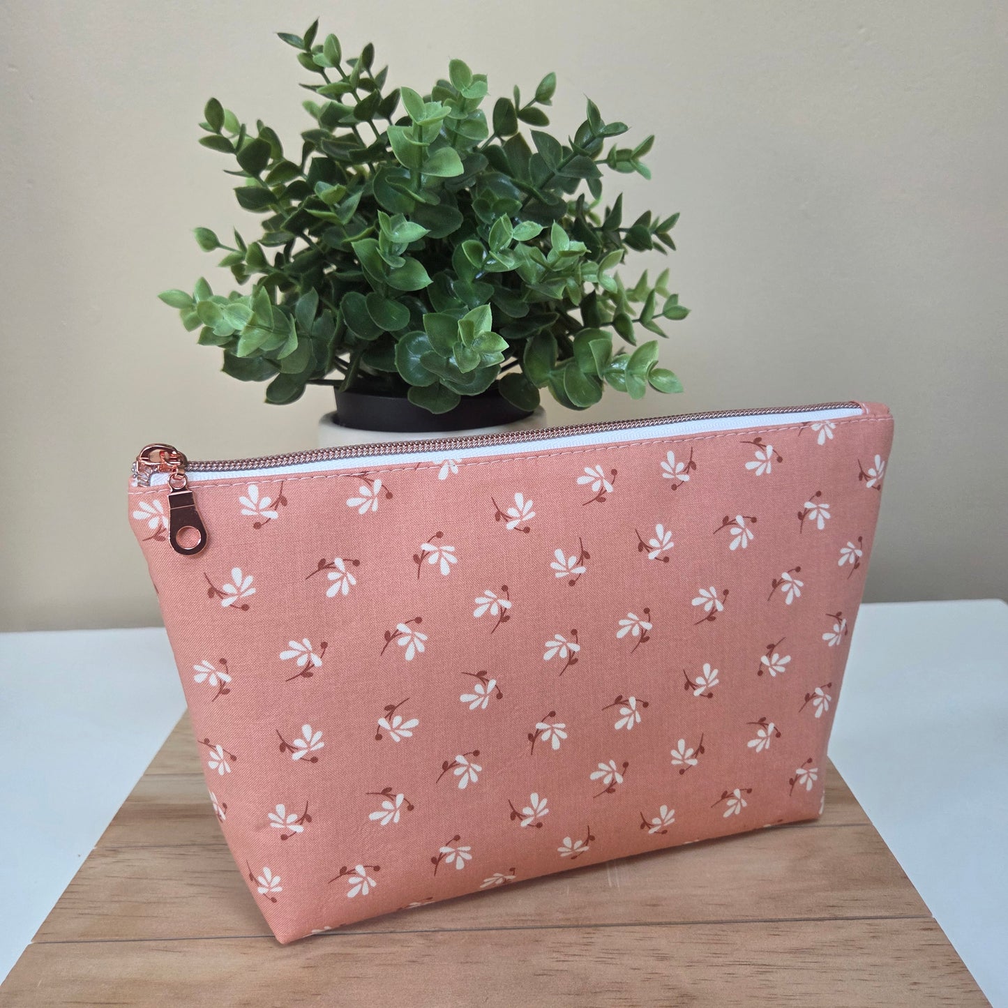 Handmade zipper pouch in clay pink floral print with rose gold zipper