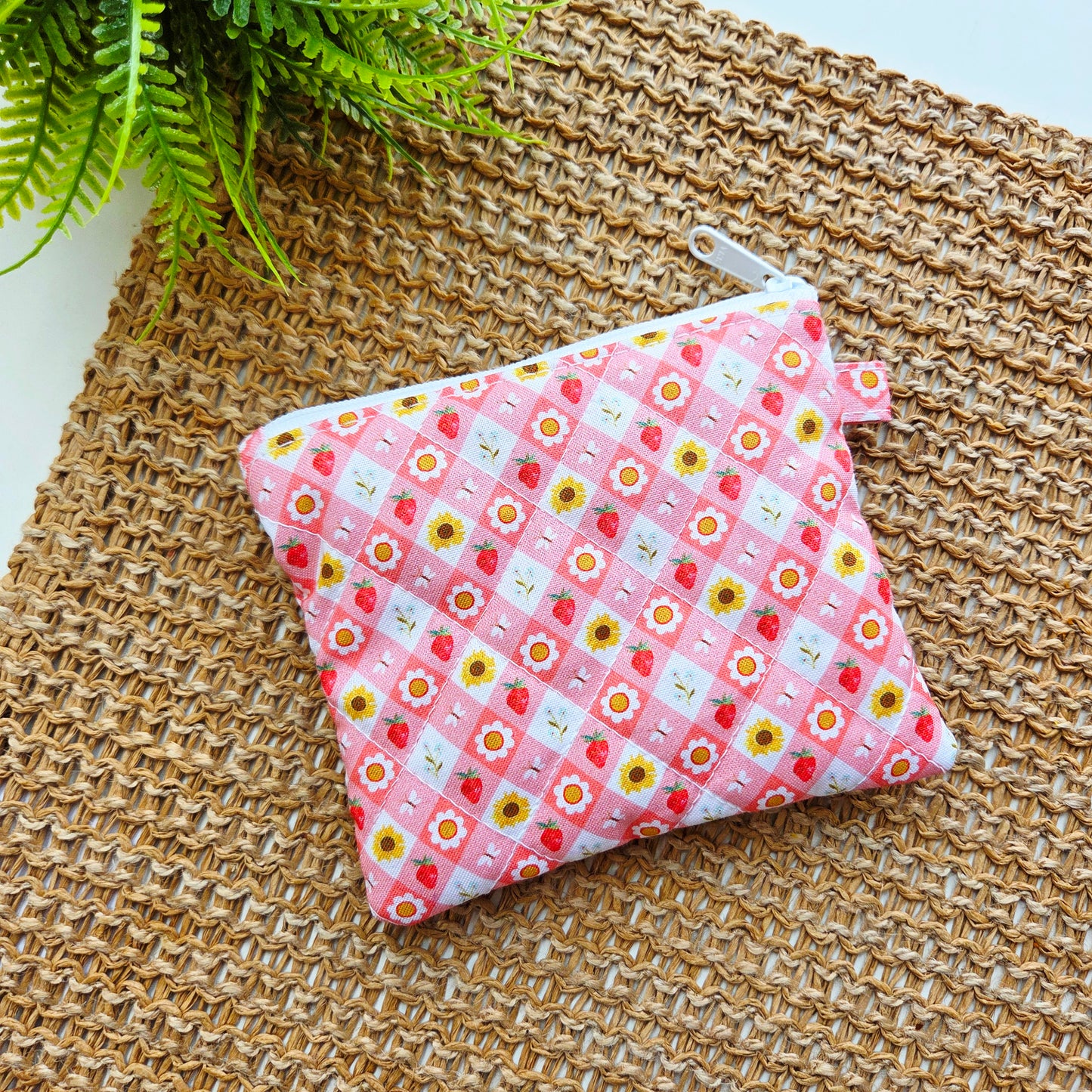 Handmade quilted keychain wallet in pink Strawberry Picnic fabric with snap closure and keyring clip