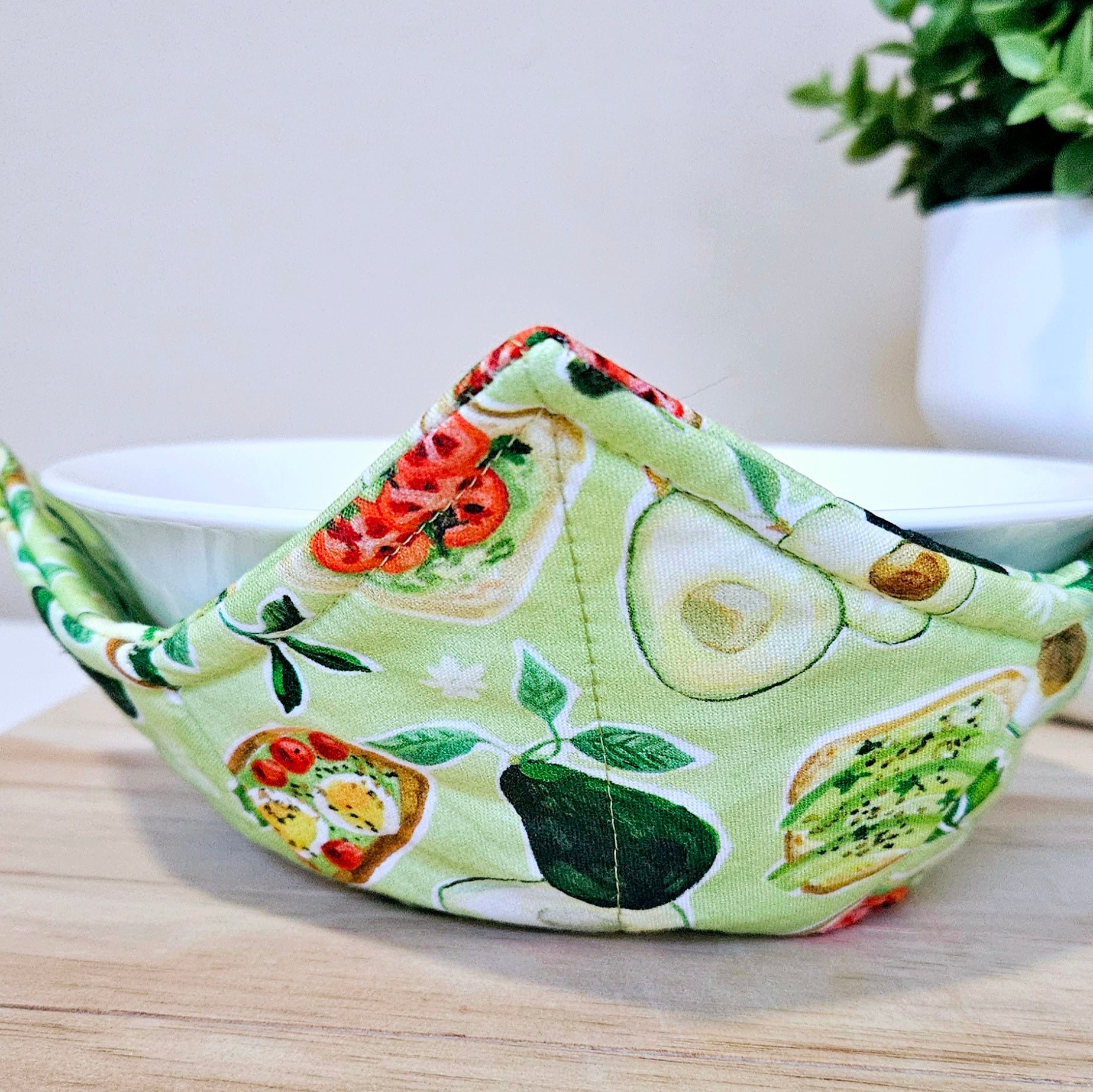 Handmade cotton bowl cozy with fun avocado print, microwave-safe and reversible