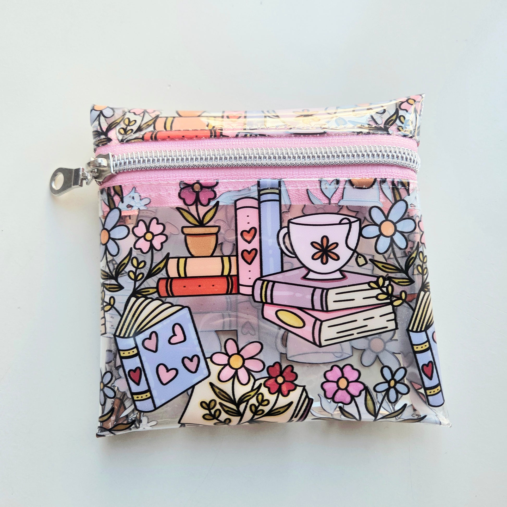Colorful pouch with book and flower pattern
