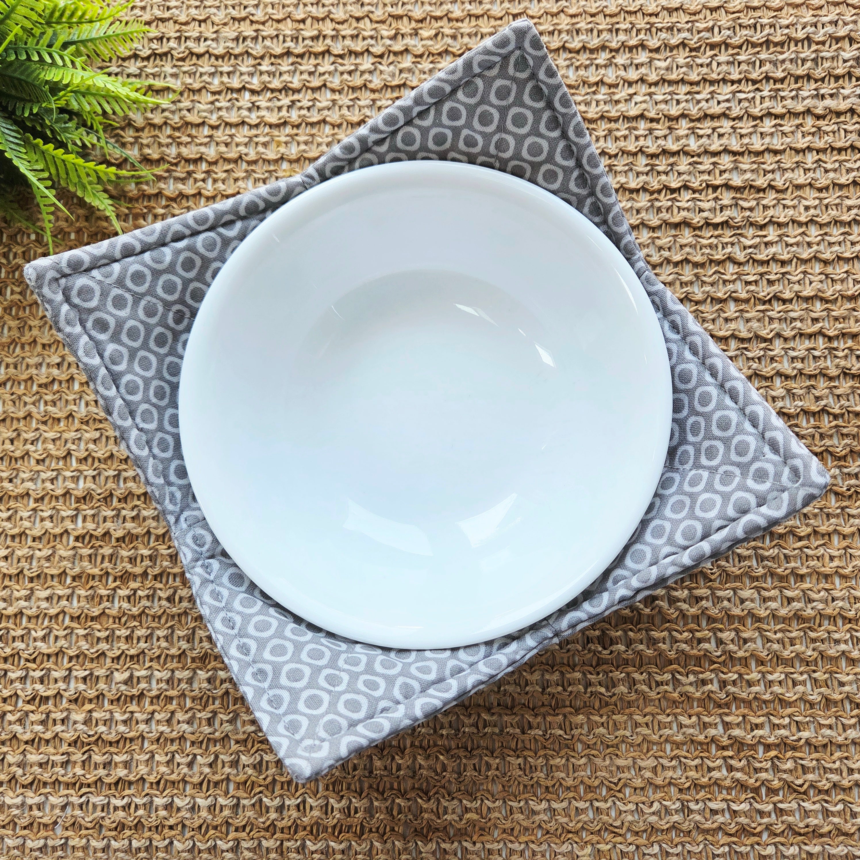 Handmade 100% cotton bowl cozy with heat-resistant padding, perfect for hot bowls