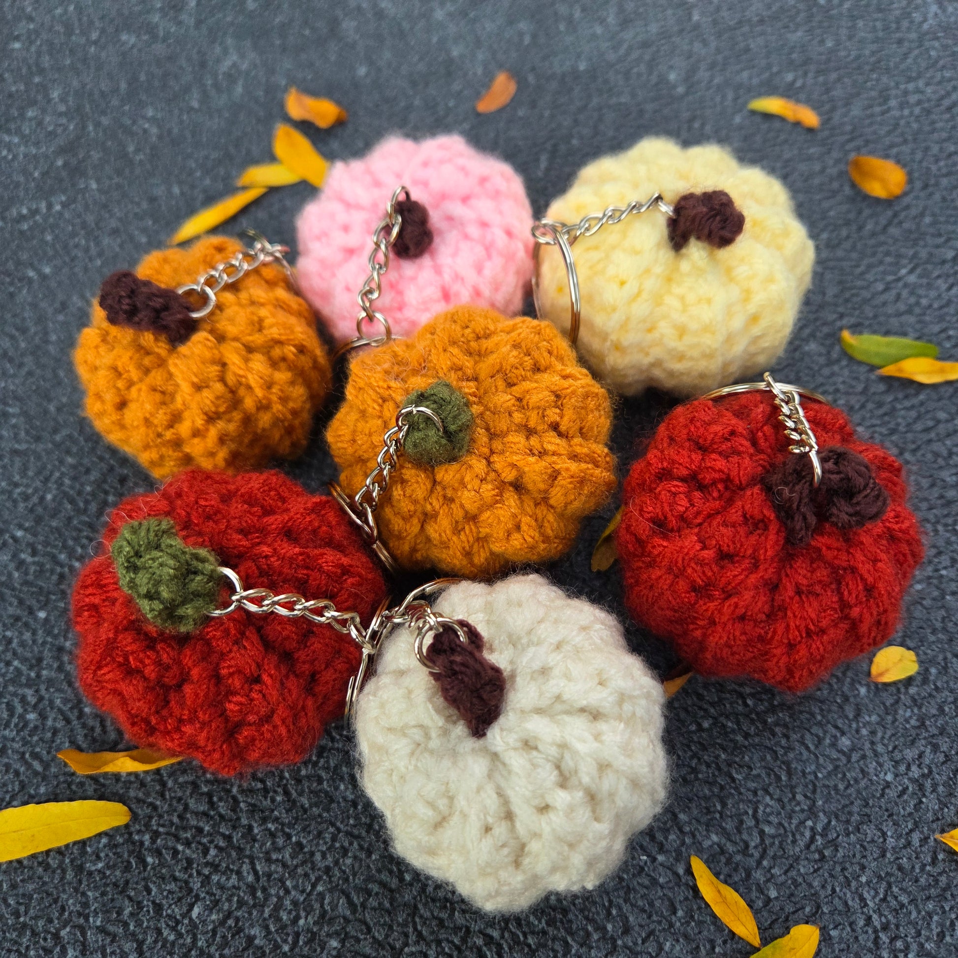 Colorful crocheted pumpkin keychains