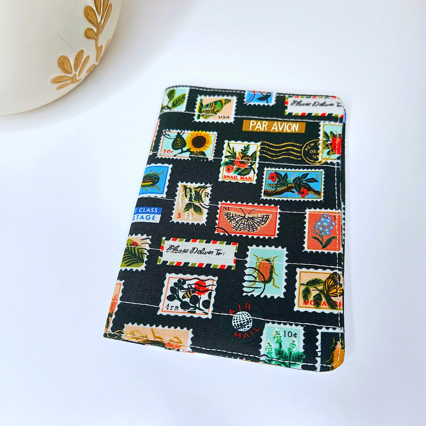 Delicate botanical passport sleeve front view