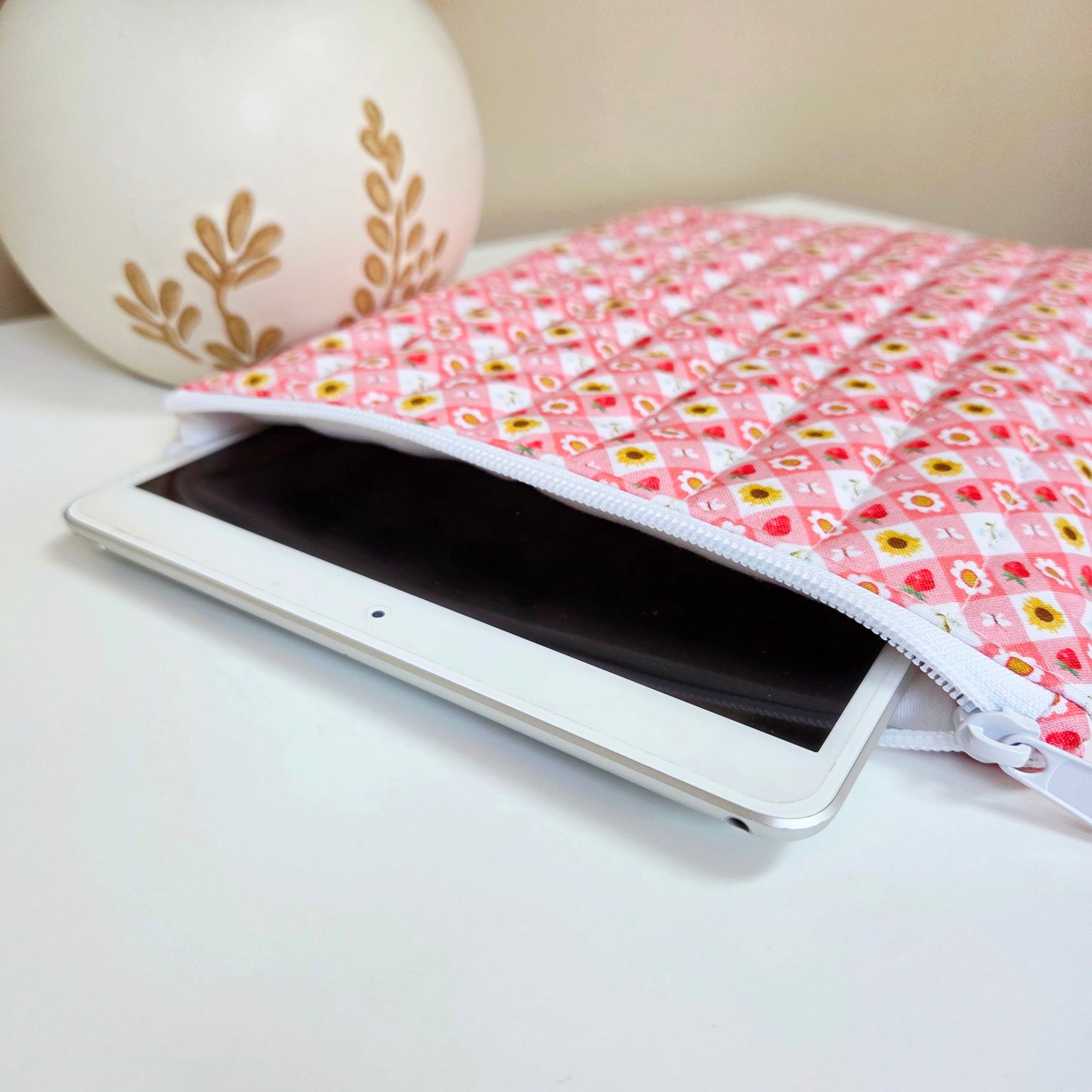 Padded iPad case with strawberry and daisy pattern fabric