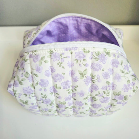 Floral-patterned pouch with a purple interior