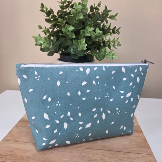 Fabric zipper pouch in soft blue with scattered white leaves