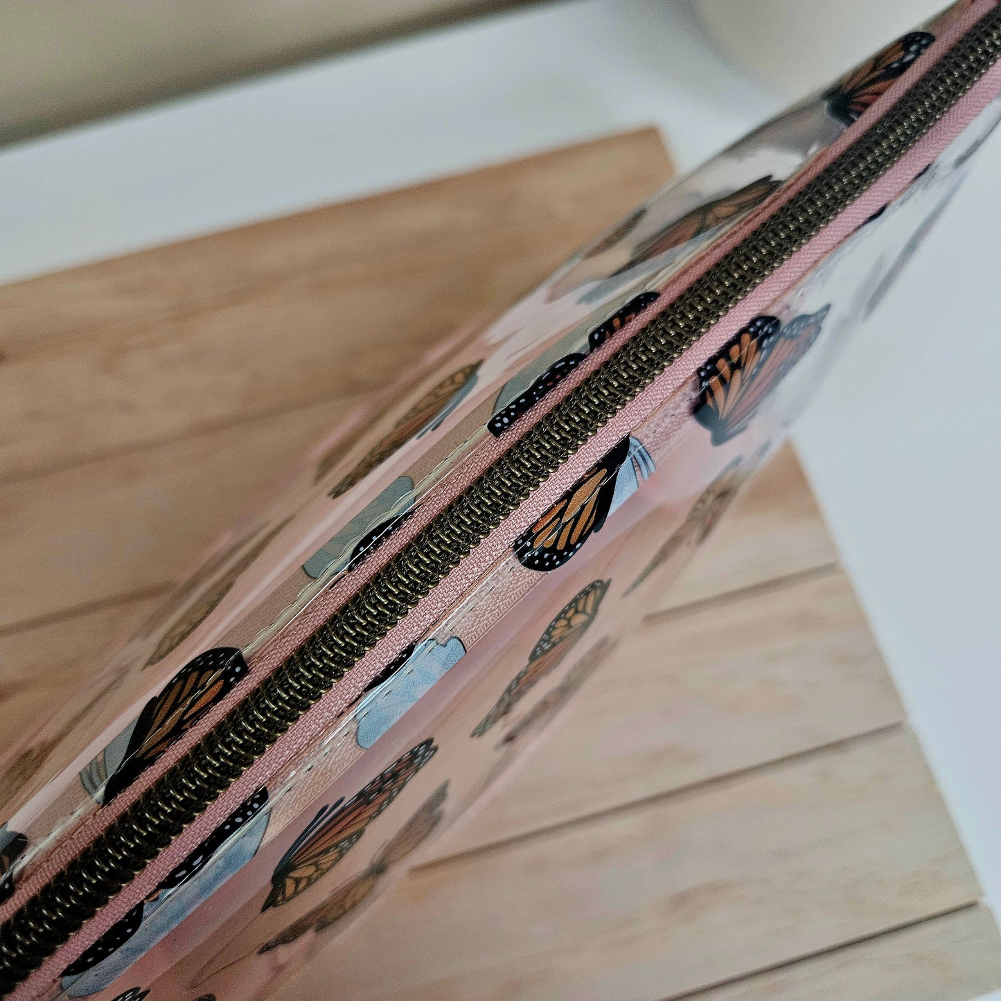 Handmade transparent makeup bag with butterflies and blush pink bottom