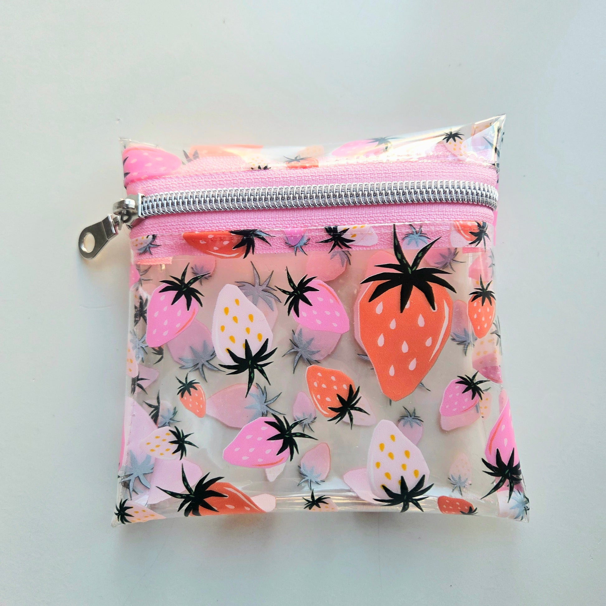 Transparent pouch with strawberry pattern and pink zipper