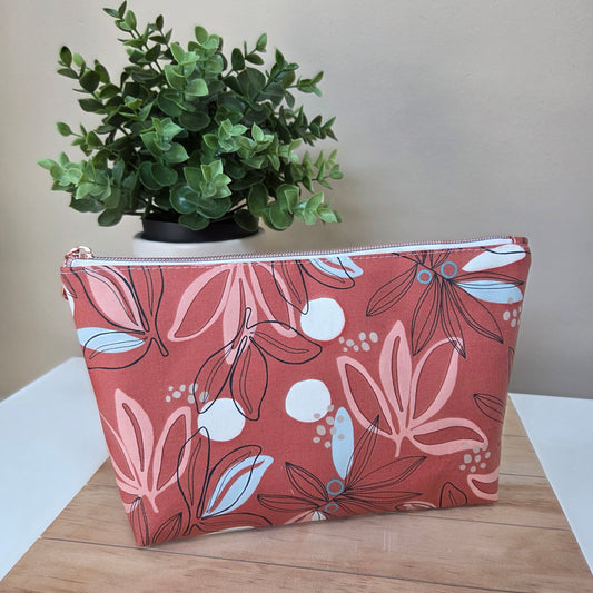 Handmade terracotta zipper pouch with floral outlines